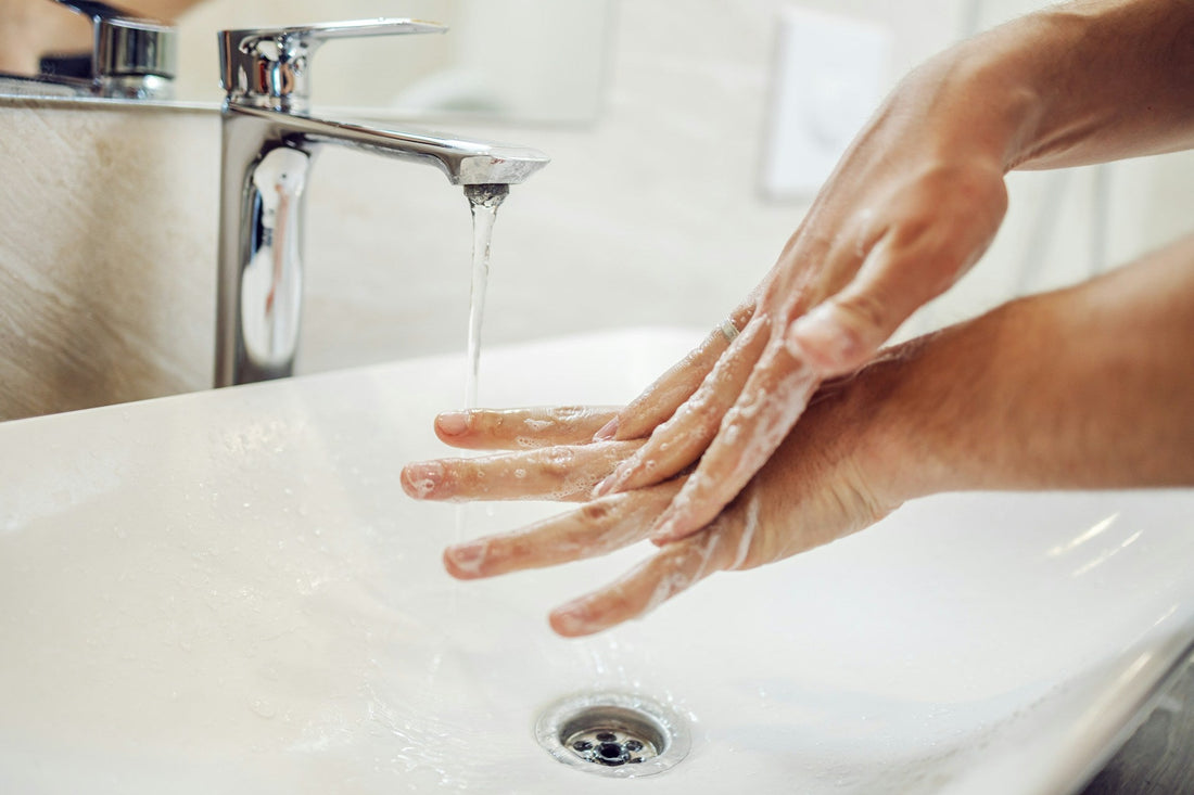 Person applying moisturizer to dry skin on their arm