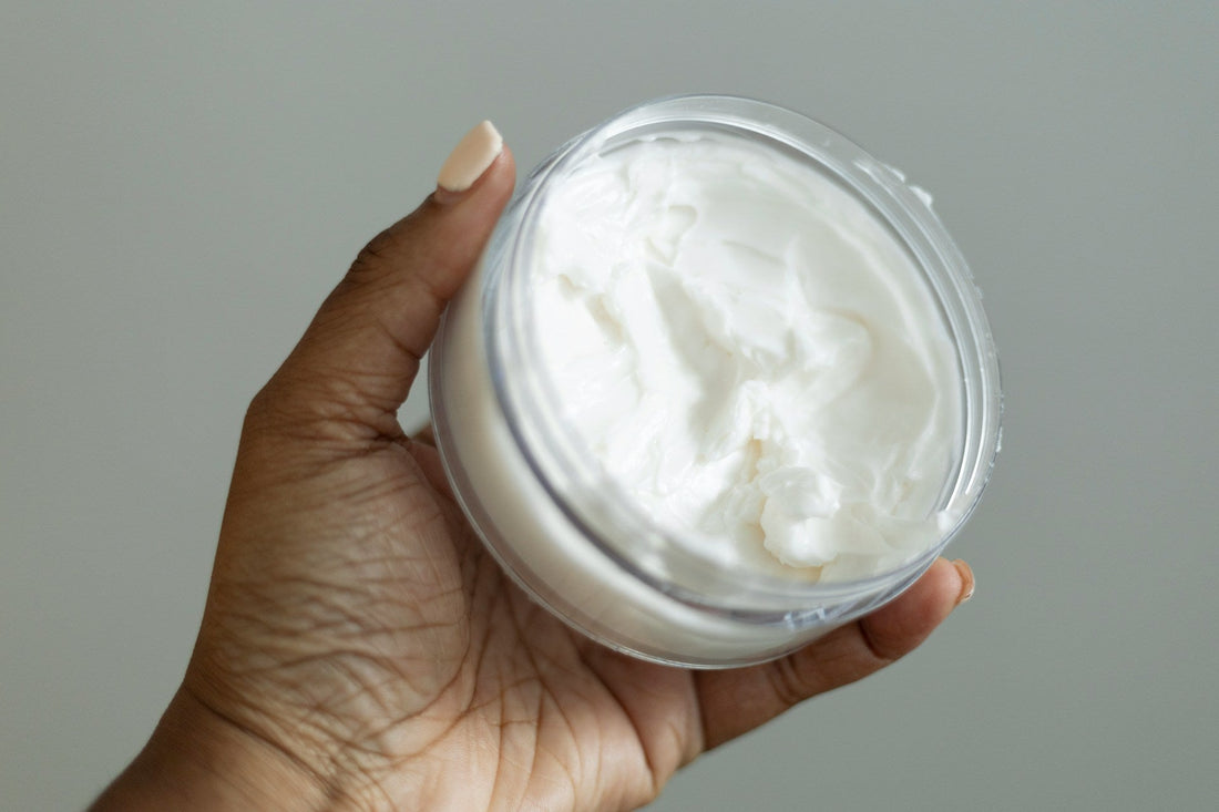 Curly hair being treated with a tallow based hair cream